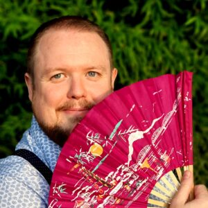 Photo portrait d'Edouard Perin avec un éventail.